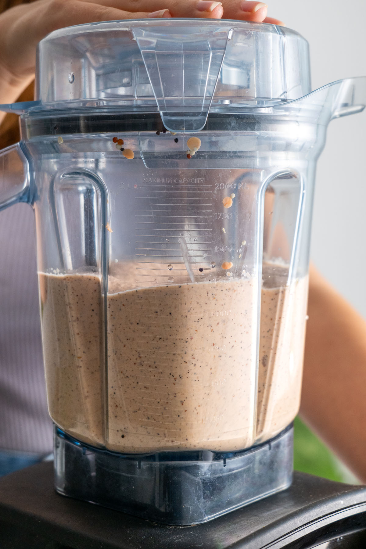 Blended mixture of lentils and quinoa inside a blender.