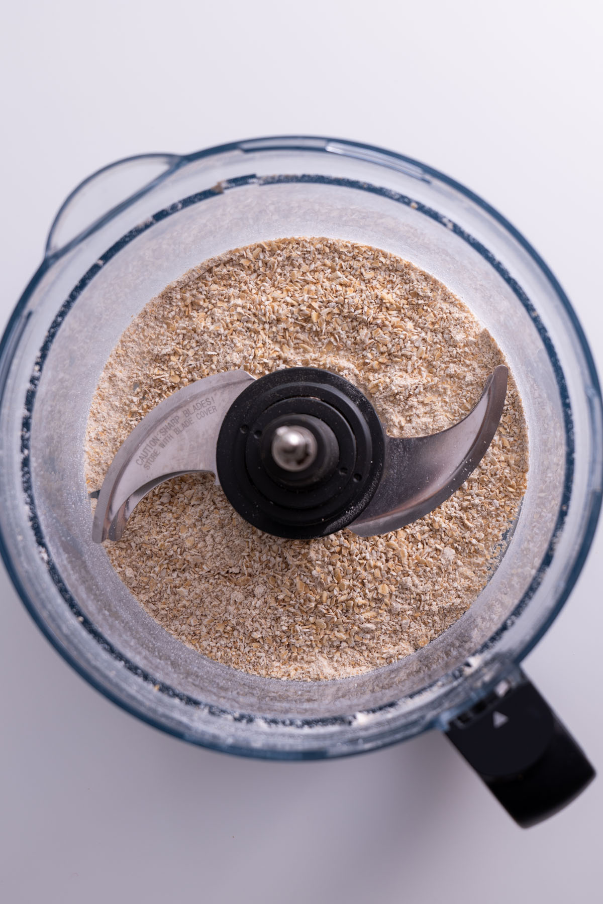 Oats processed into fine flour for chickpea cookie dough bliss balls.