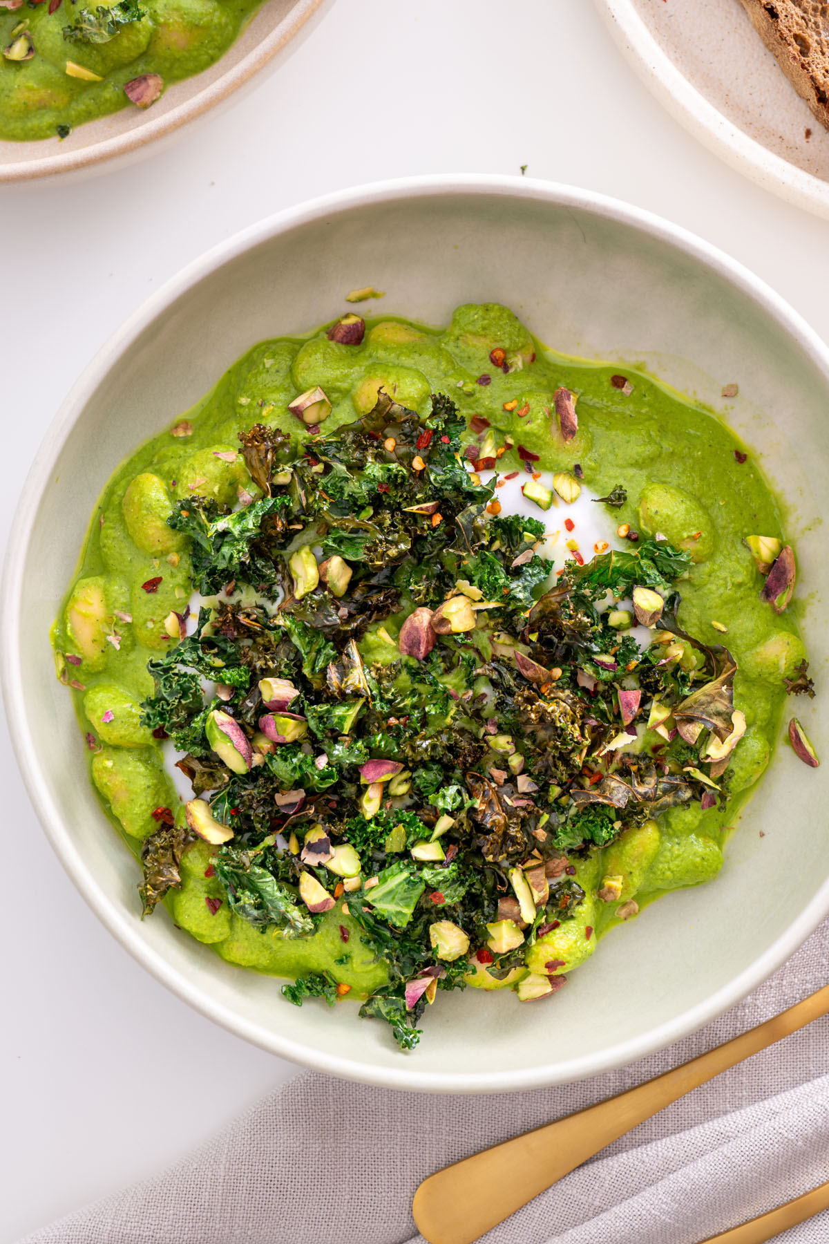 Close-up of fresh green sauce with butter beans for Super Green Butter Beans recipe in a pan