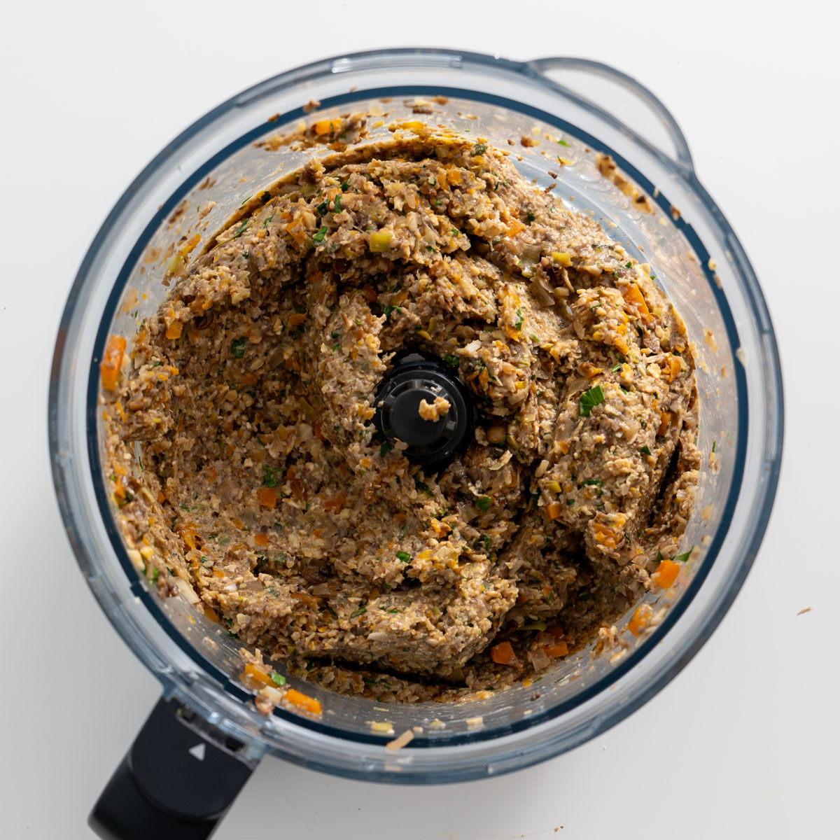 Process shot of mushroom Wellington filling blended in a food processor.
