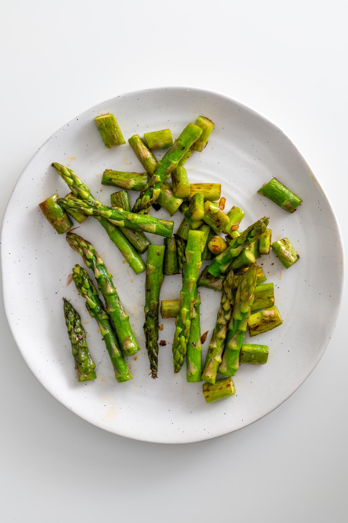 Close-up of cooked corn kernels on a white plate