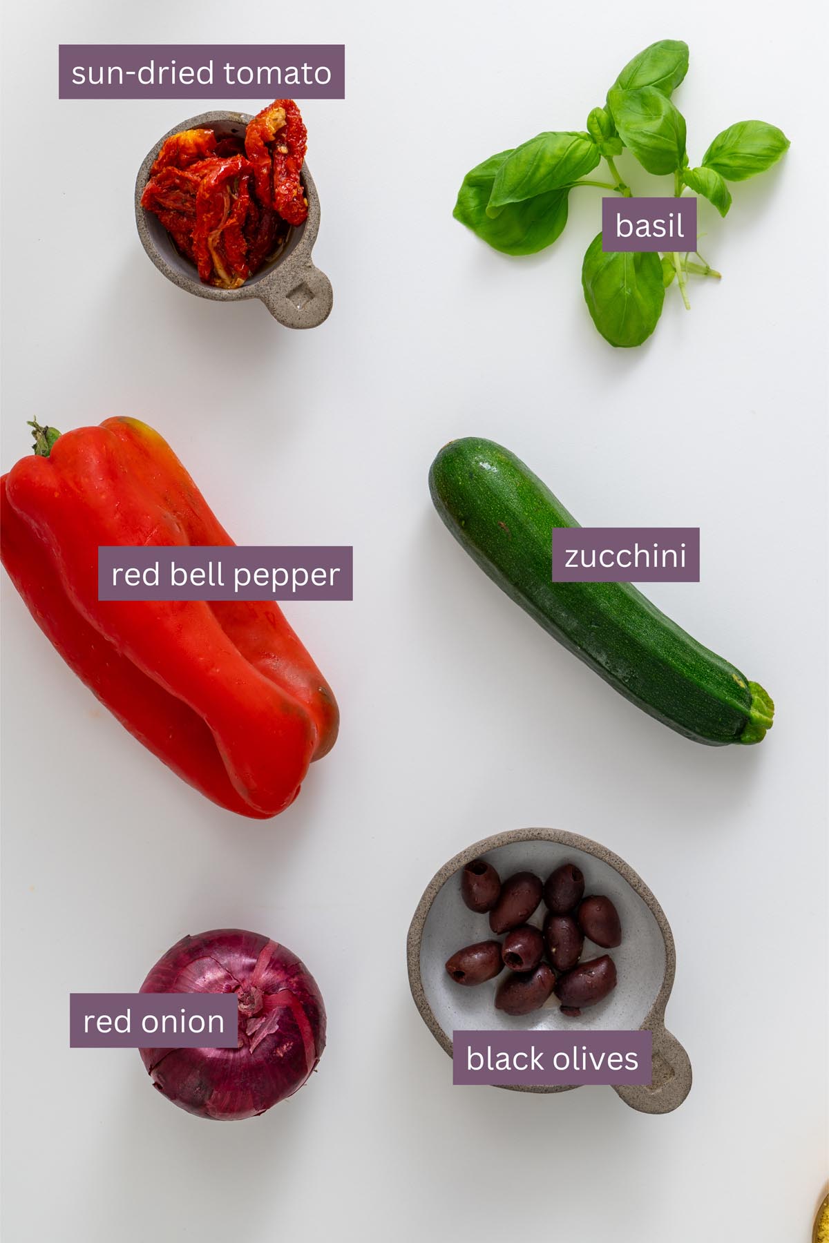 Sliced red bell pepper and chili on a white background
