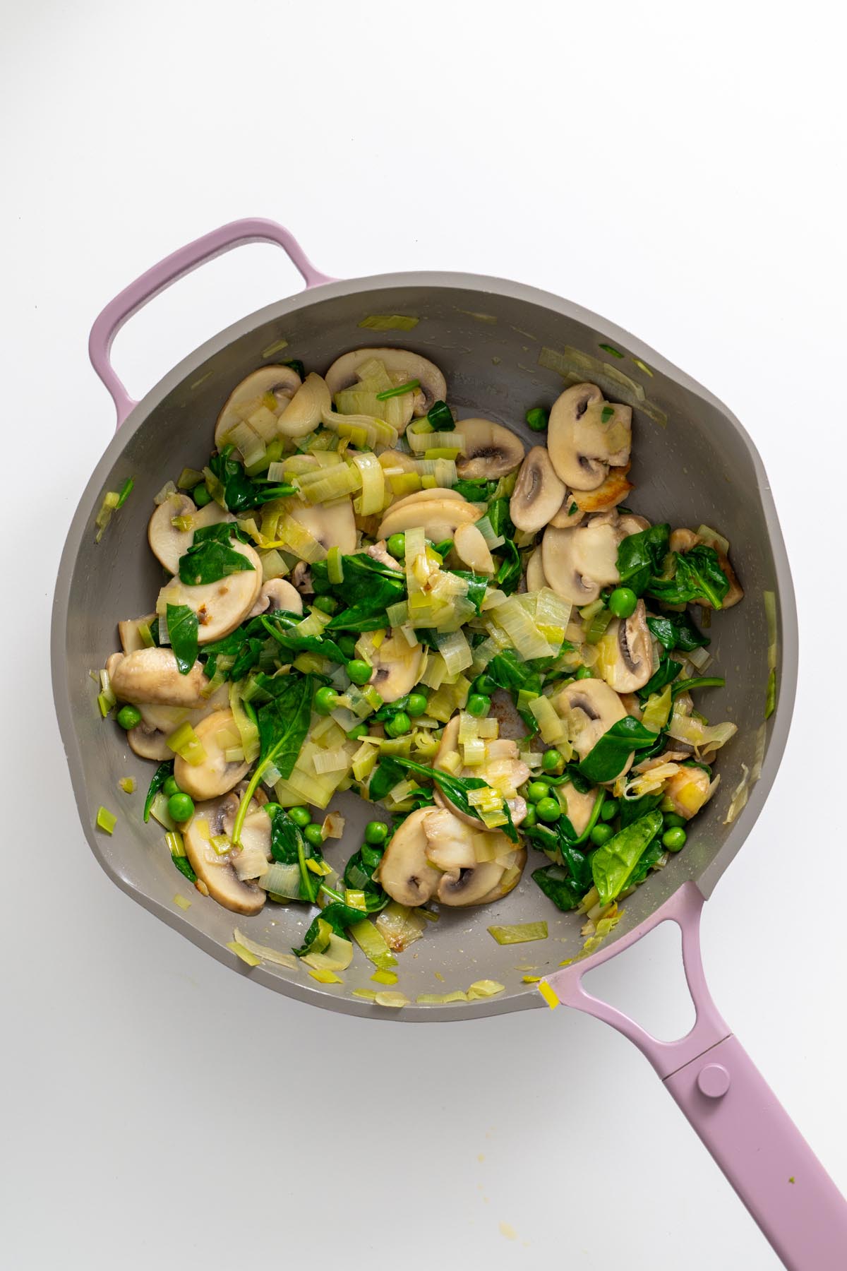 Prepared tart crust filled with cooked vegetable mixture