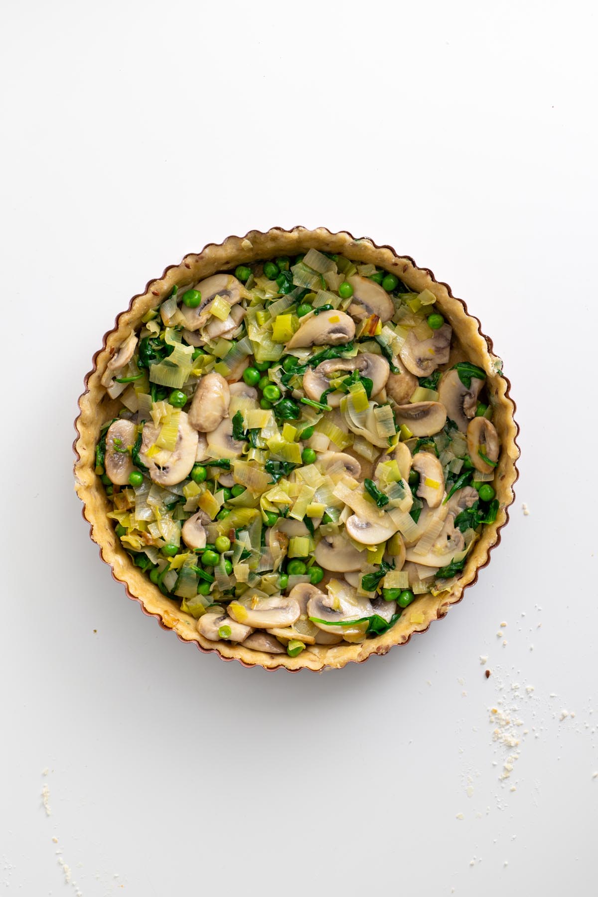 Labeled main ingredients including leek, mushrooms, baby spinach, and frozen peas