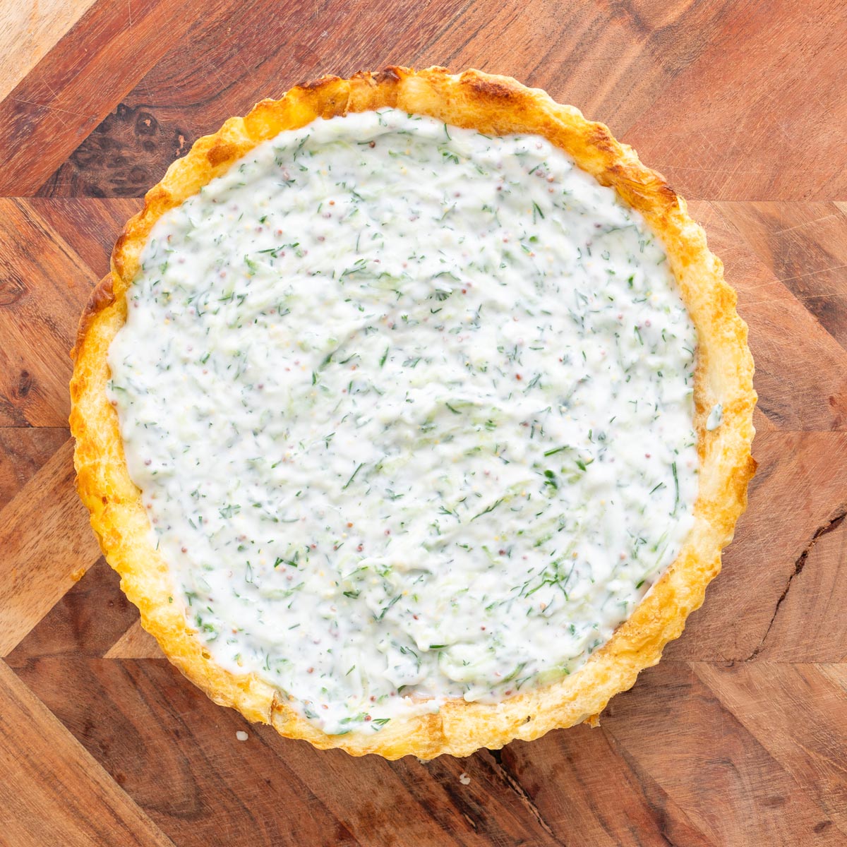 Before baking, potato crust in the tin