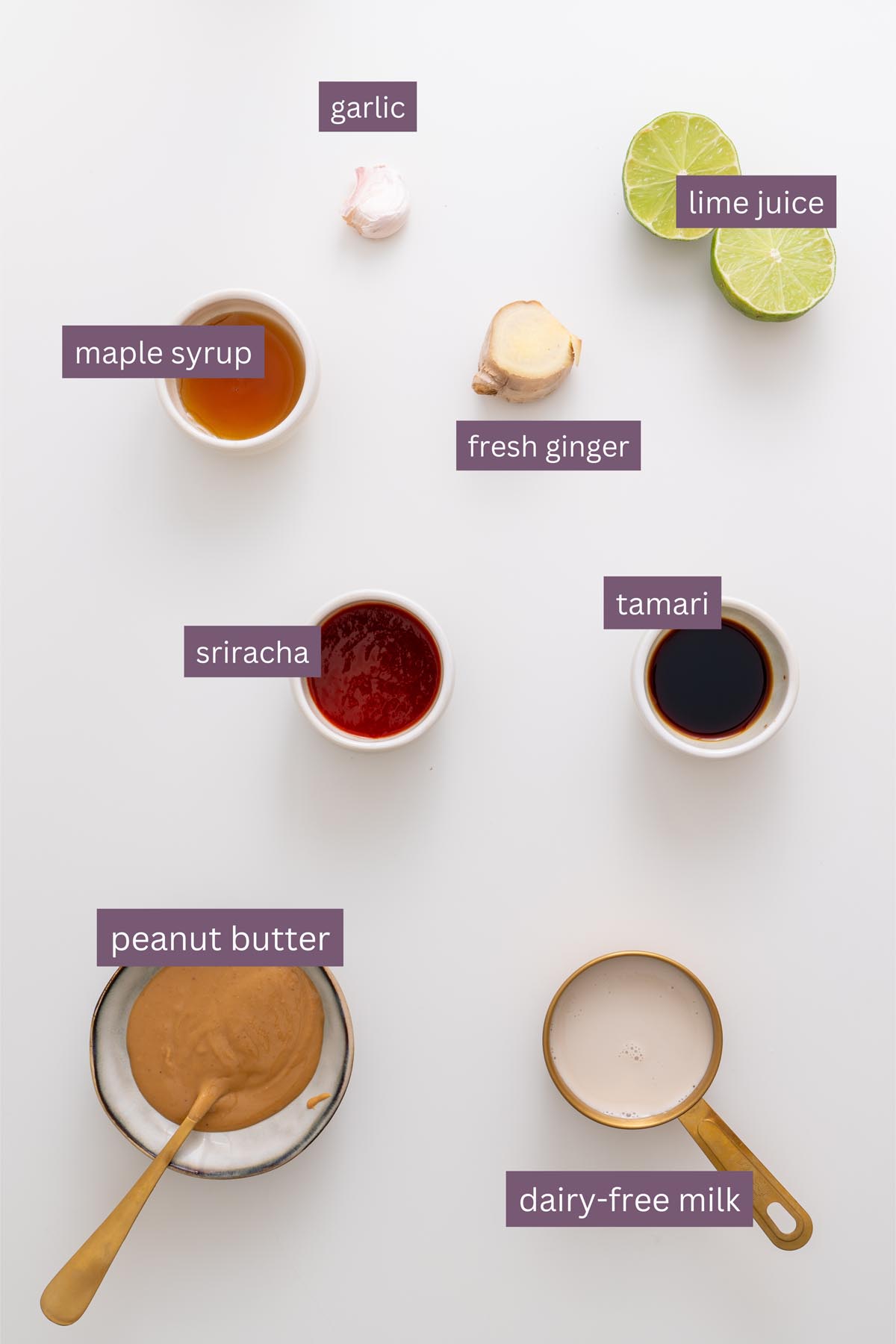 Vibrant ingredients for a potato salad on a white surface